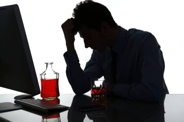 Silhouette Of Sad And Depressed Young Man In Alcohol Addiction