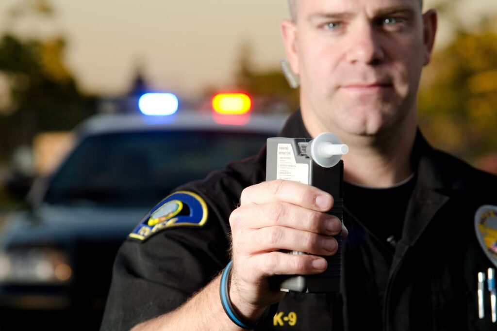 Policeman getting ready to charge someone for not following DUI laws in Idaho
