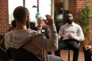 a group discusses What to expect in rehab