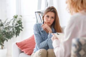 Person talking to their therapist about dual diagnosis treatment