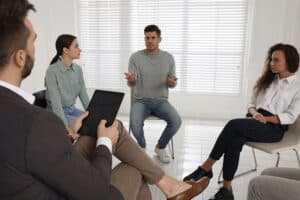 People sitting in a circle at an alcohol detox treatment center