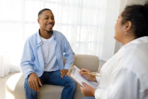 Person talking to their therapist and experiencing dialectical behavior therapy benefits