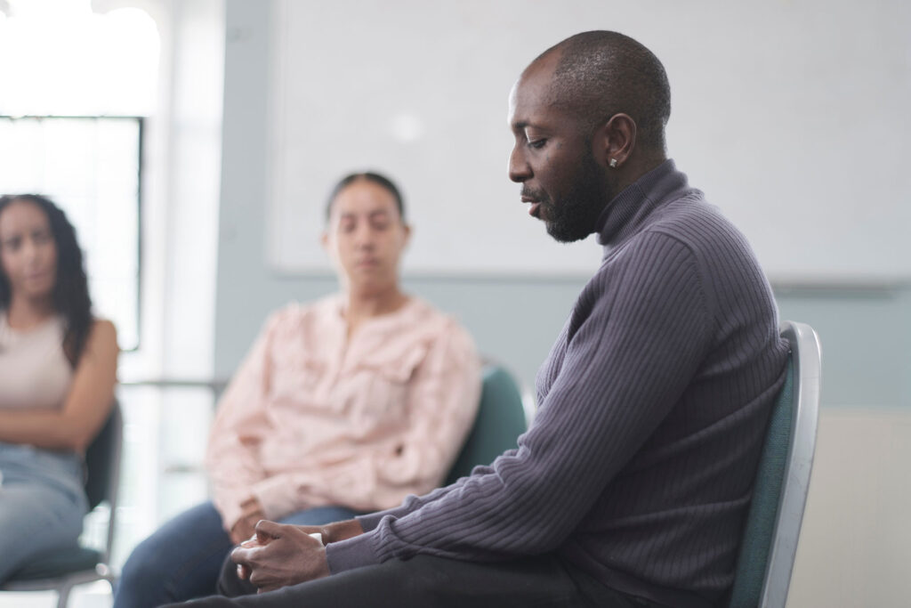 Man sitting in a relapse prevention program in Boise, ID