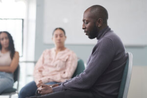 Man sitting in a relapse prevention program in Boise, ID
